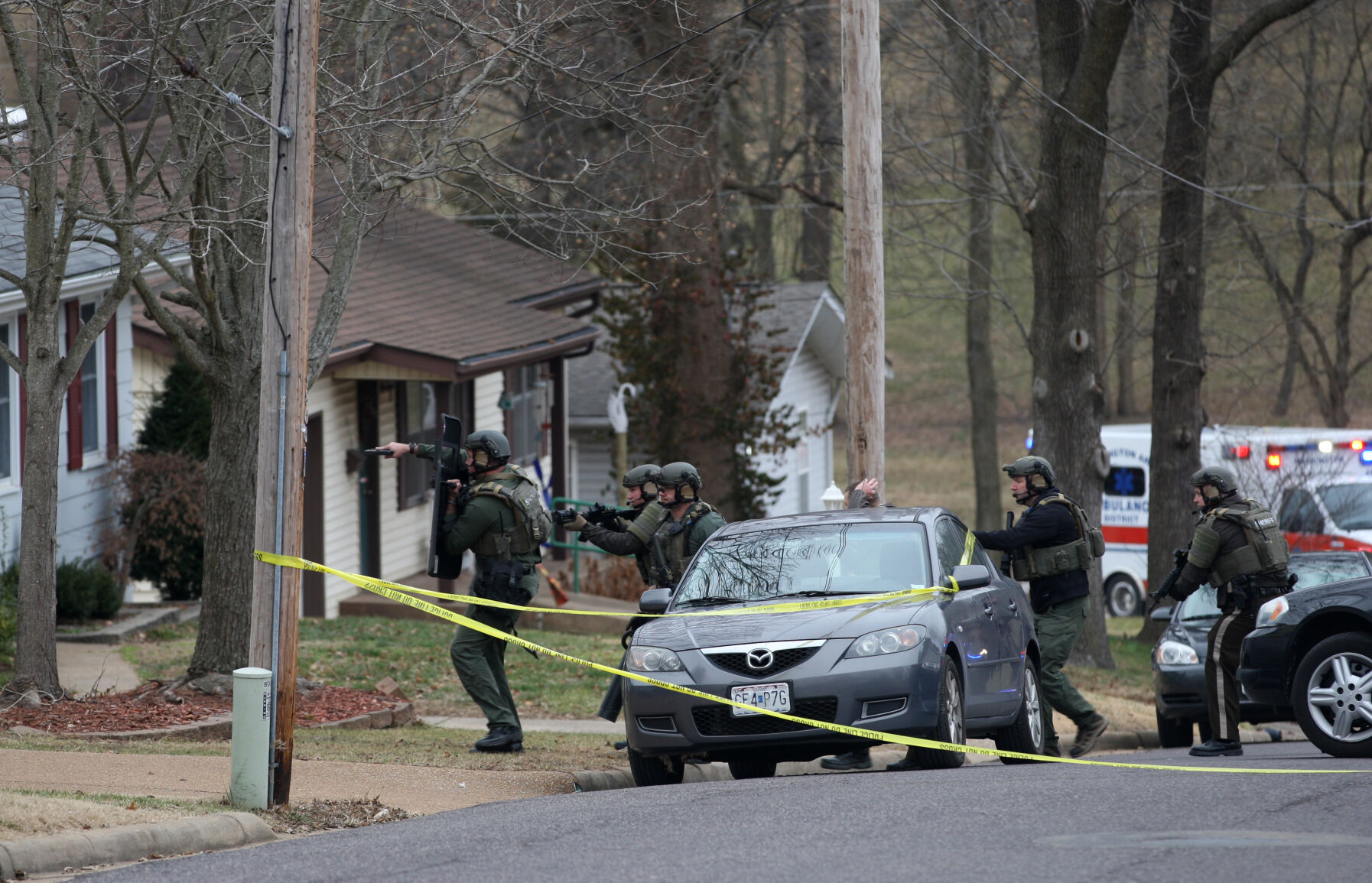Franklin County SWAT team walks toward a home
